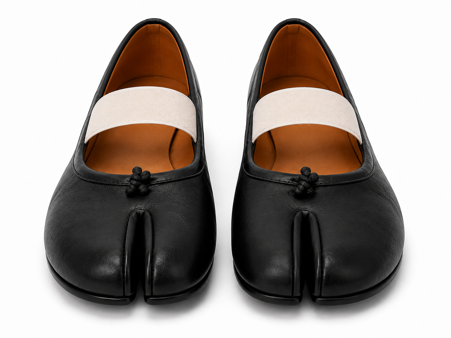 A pair of black leather tabi-style flats with a wide off-white fabric band across the top and a small black decorative knot detail on the front, shown against a plain white background.